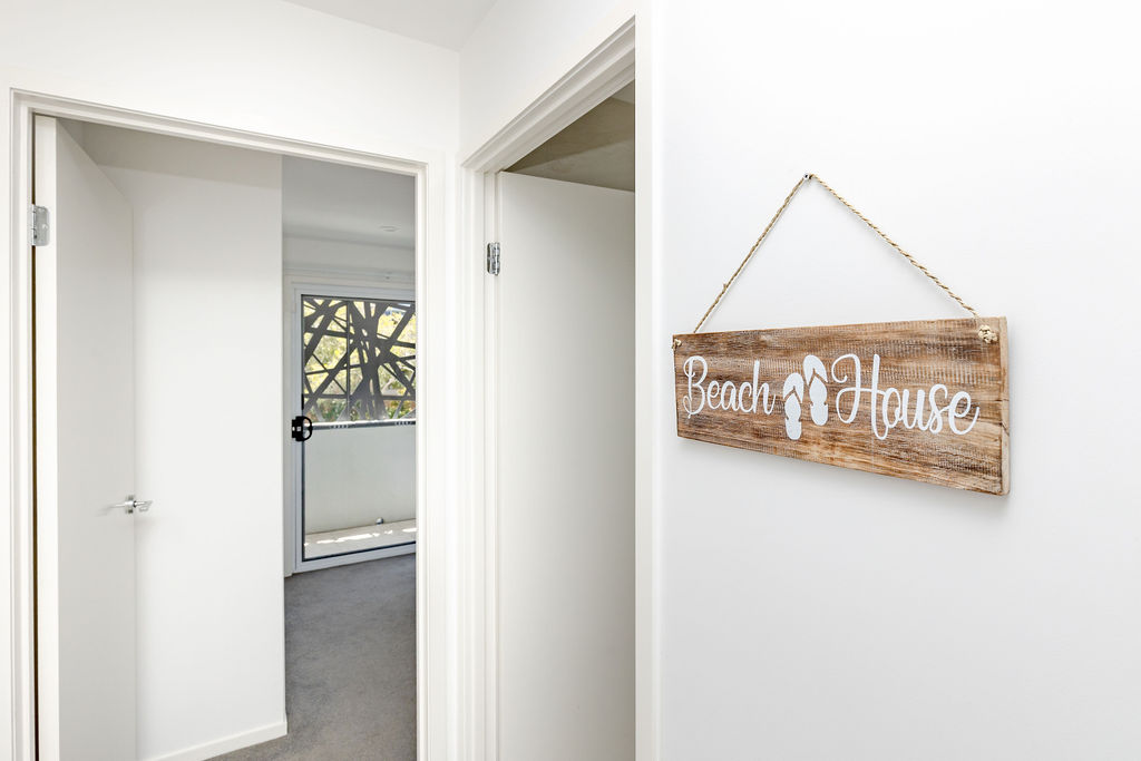 Beach House sign hanging in the entryway